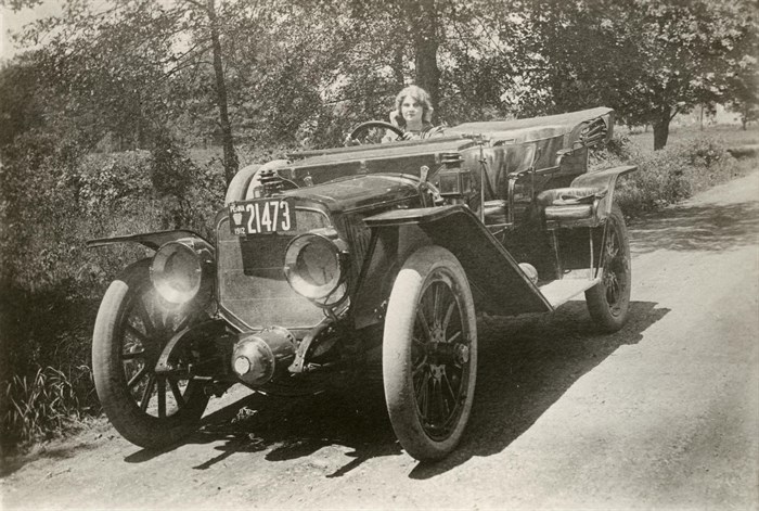 Florence sits in a Lozier open touring car with 1912 florence in a lozier open touring car
